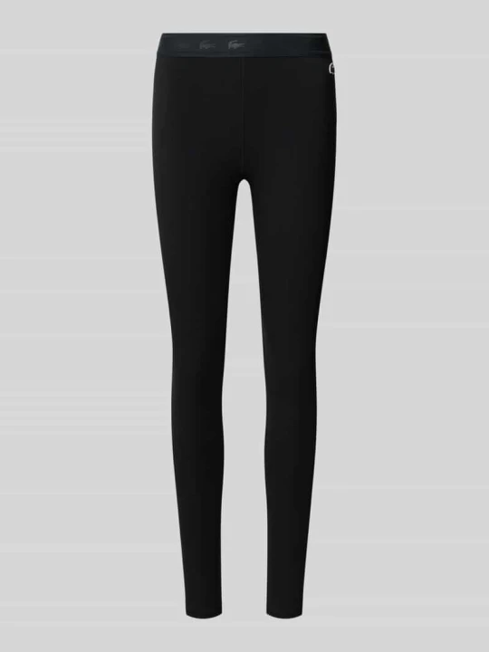 Zdjęcie produktu legginsy sportowe o kroju slim fit z nadrukiem z logo Lacoste Czarny