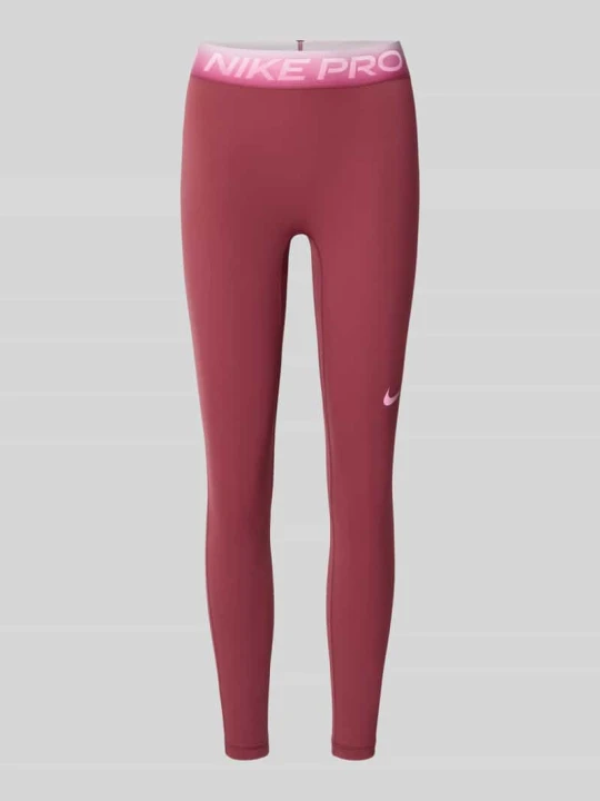 Zdjęcie produktu legginsy sportowe o kroju slim fit z nadrukiem z logo Nike Bordowy