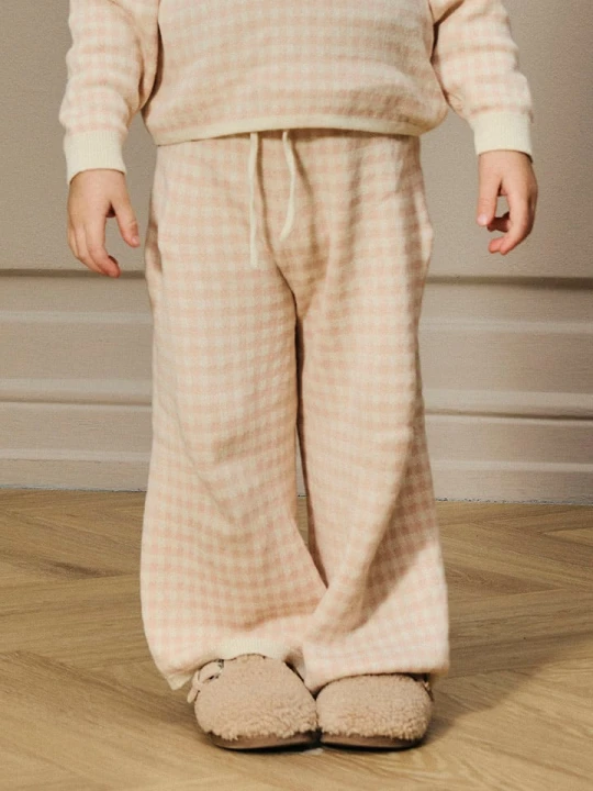 Zdjęcie produktu Lil Atelier Spodnie "Nadie" w kolorze beżowo-jasnoróżowym rozmiar: 92 Lil' Atelier