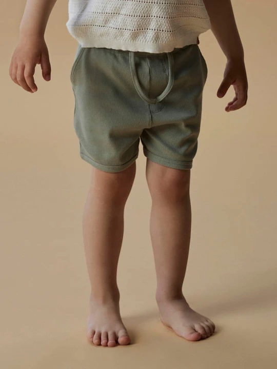 Zdjęcie produktu Lil Atelier Szorty "Gago" w kolorze jasnozielonym rozmiar: 110 Lil' Atelier