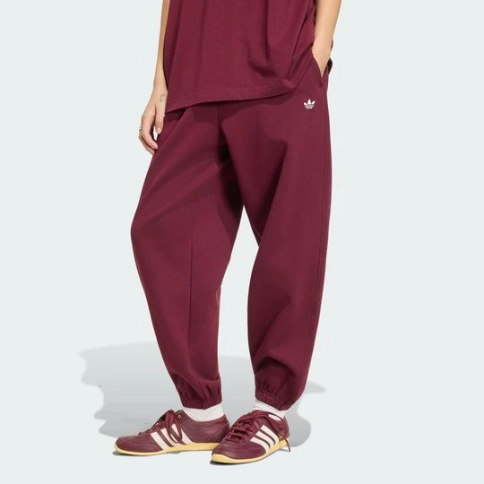 Zdjęcie produktu LUŹNE POLAROWE SPODNIE DRESOWE ESSENTIALS Adidas bordowy