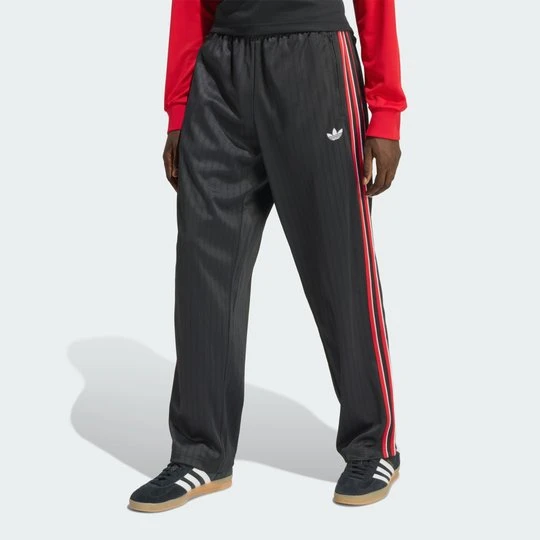 Zdjęcie produktu Luźne spodnie dresowe w prążki Firebird Adidas czarny