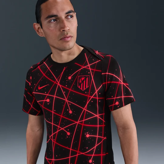 Zdjęcie produktu Męska przedmeczowa koszulka piłkarska z krótkim rękawem Nike Dri-FIT Atlético Madryt Academy Pro - Czerń