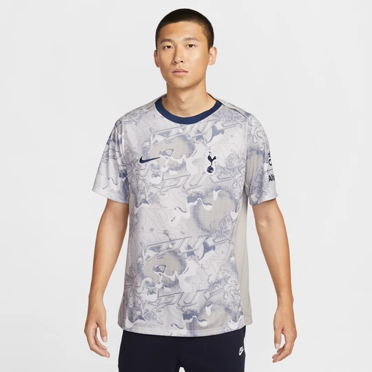 Zdjęcie produktu Męska przedmeczowa koszulka piłkarska z krótkim rękawem Nike Dri-FIT Tottenham Hotspur Academy Pro (wersja domowa) - Biel