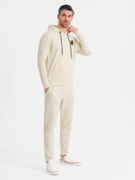 Zdjęcie produktu Męski komplet dresowy bluza z kapturem + spodnie dresowe - kremowy V2 - Rozmiar: M Ombre Clothing