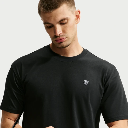 Zdjęcie produktu Męski T-shirt do golfa o luźnym kroju Nike Dri-FIT - Czerń