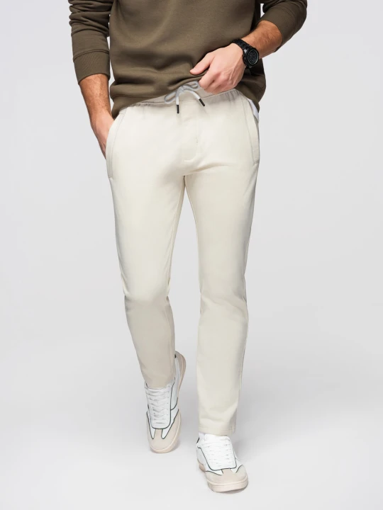 Zdjęcie produktu Męskie bawełniane spodnie dresowe BASIC z nogawką bez ściągacza - kremowe V11 - Rozmiar: XL Ombre Clothing kremowy