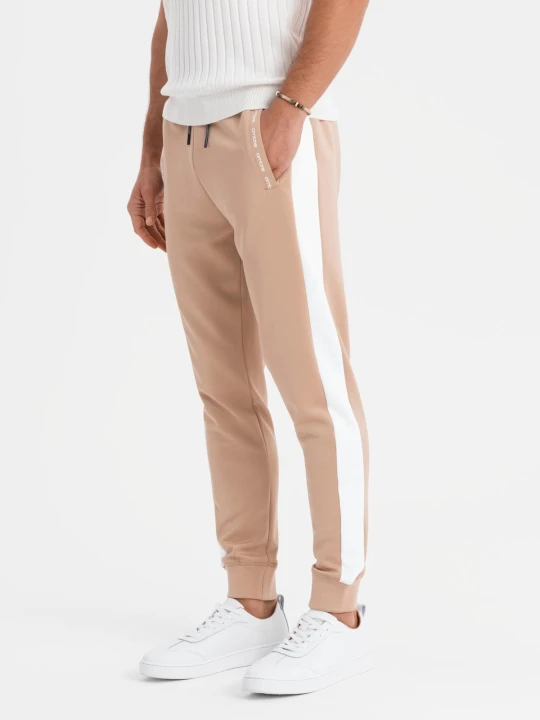 Zdjęcie produktu Męskie dresowe spodnie joggery z kontrastowymi lampasami – beżowe V4 Ombre Clothing