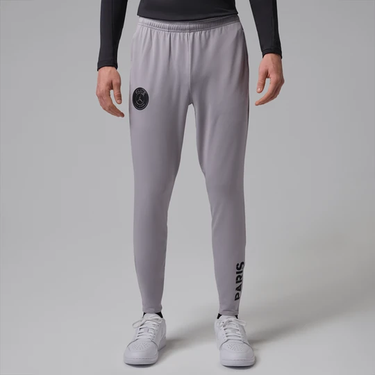 Zdjęcie produktu Męskie dzianinowe spodnie piłkarskie Jordan Dri-FIT Paris Saint-Germain Strike (edycja nocna) - Szary
