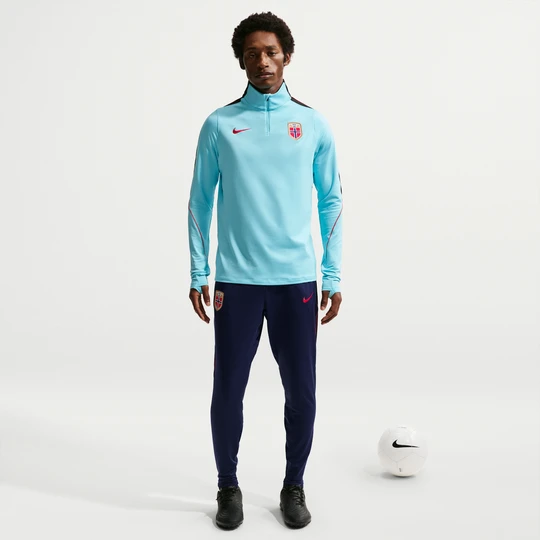 Zdjęcie produktu Męskie dzianinowe spodnie piłkarskie Nike Dri-FIT Norwegia Strike - Niebieski