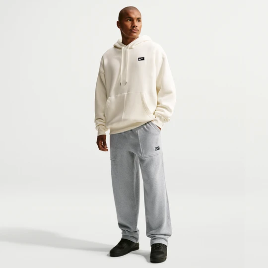Zdjęcie produktu Męskie dzianinowe spodnie z nogawkami bez ściągaczy Nike - Szary