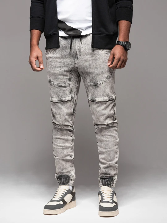 Zdjęcie produktu Męskie jeansowe spodnie joggery z przetarciami i zamkami – szare V4 - Rozmiar: S Ombre Clothing