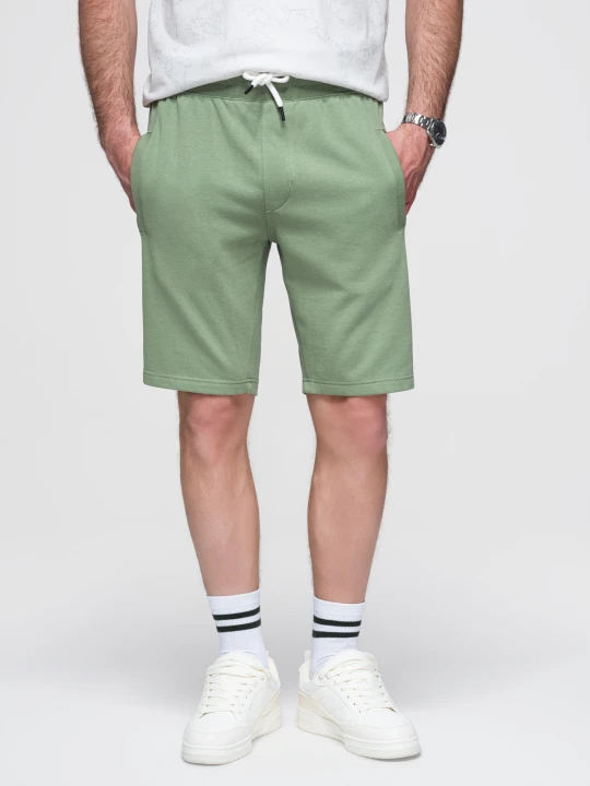 Zdjęcie produktu Męskie spodenki dzianinowe ze ściągaczem i kieszeniami - zielone V3 - Rozmiar: XXL Ombre Clothing