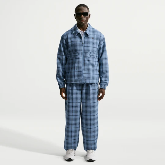 Zdjęcie produktu Męskie spodnie do golfa o luźnym kroju Nike Tartan - Niebieski