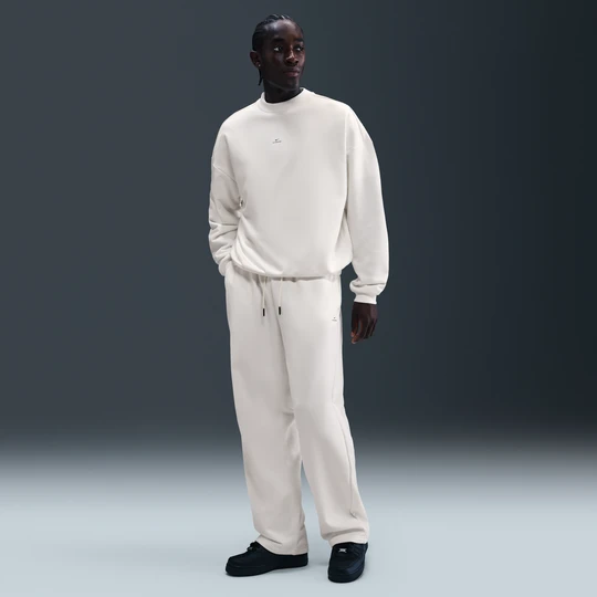 Zdjęcie produktu Męskie spodnie do koszykówki ze szczotkowanej dzianiny z luźnymi nogawkami Therma-FIT Nike Standard Issue - Biel