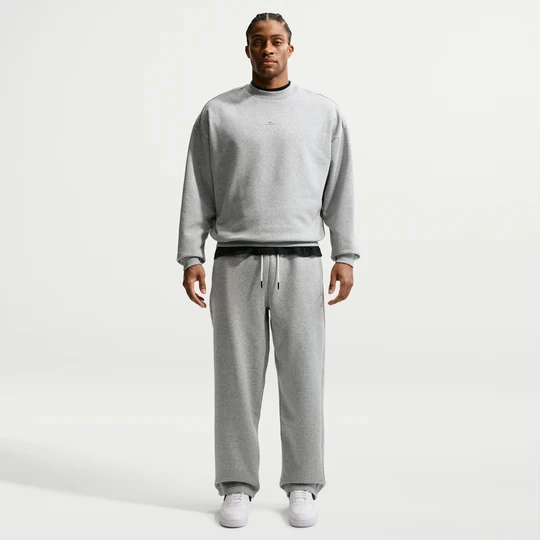 Zdjęcie produktu Męskie spodnie do koszykówki ze szczotkowanej dzianiny z luźnymi nogawkami Therma-FIT Nike Standard Issue - Szary