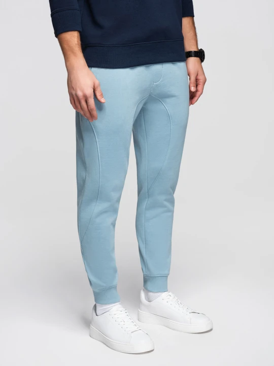 Zdjęcie produktu Męskie spodnie dresowe ze ściągaczem przy nogawce BASIC jogger - niebieskie V7 - Rozmiar: L Ombre Clothing