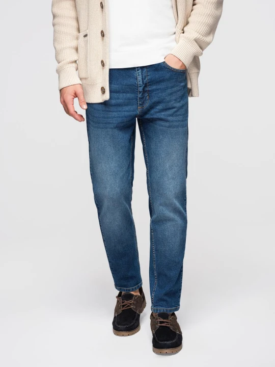 Zdjęcie produktu Męskie spodnie jeansowe CARROT z przetarciami - niebieskie V2 - Rozmiar: L Ombre Clothing