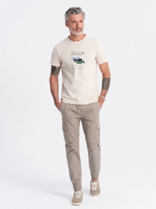 Zdjęcie produktu Męskie spodnie JOGGERY z zapinanymi kieszeniami cargo - beżowe V2 - Rozmiar: XL Ombre Clothing