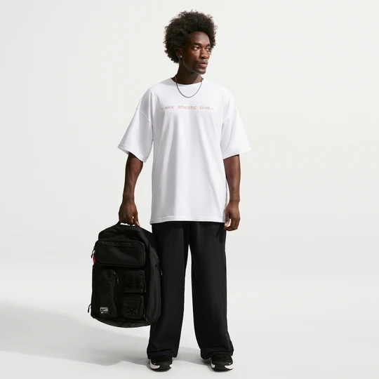 Zdjęcie produktu Męskie spodnie Nike z tkaniny o kroju oversize N.A.C. Dri-FIT - Czerń