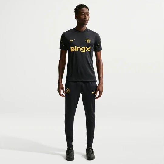 Zdjęcie produktu Męskie spodnie piłkarskie z dzianiny Nike Dri-FIT Chelsea F.C. Strike - Niebieski