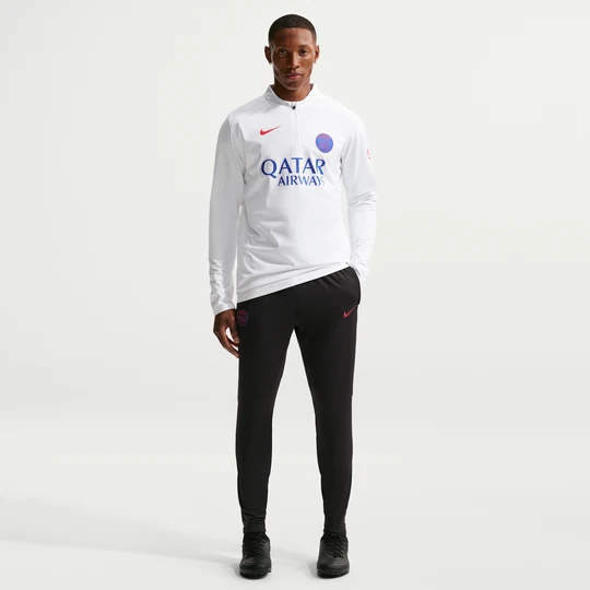 Zdjęcie produktu Męskie spodnie piłkarskie z dzianiny Nike Dri-FIT Paris Saint-Germain Strike - Czerń