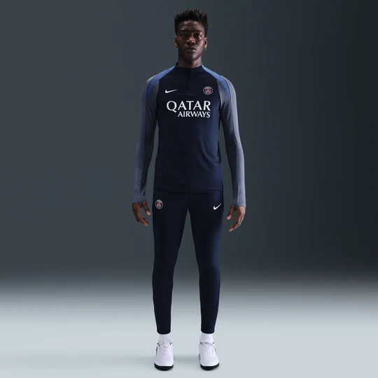 Zdjęcie produktu Męskie spodnie piłkarskie z dzianiny Nike Dri-FIT Paris Saint-Germain Strike - Niebieski