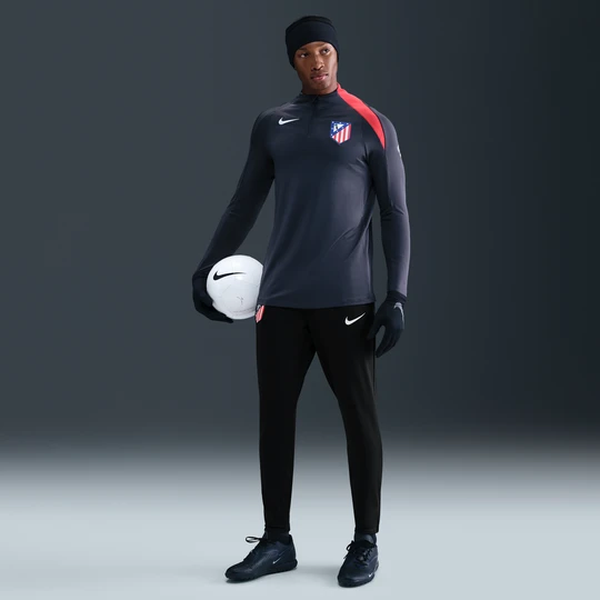 Zdjęcie produktu Męskie spodnie piłkarskie z dzianiny Nike Dri-FIT Total 90 Atlético Madryt Strike (wersja trzecia) - Czerń