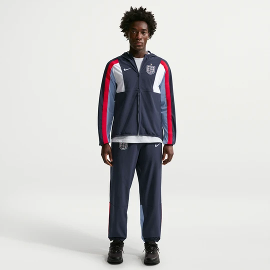 Zdjęcie produktu Męskie spodnie piłkarskie z tkaniny Nike Dri-FIT Anglia Energy - Niebieski
