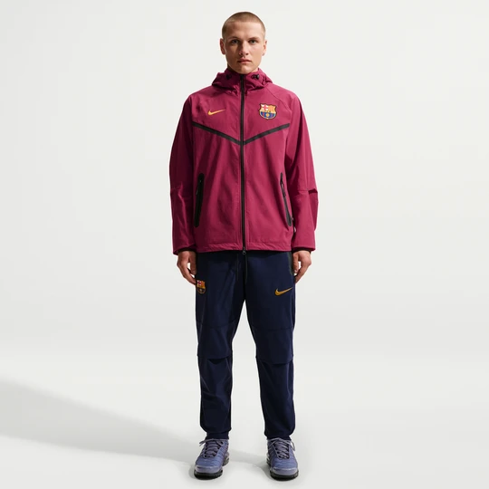 Zdjęcie produktu Męskie spodnie piłkarskie z tkaniny Nike F.C. Barcelona Tech - Niebieski