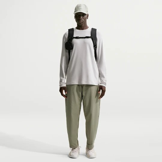 Zdjęcie produktu Męskie spodnie treningowe z tkaniny Dri-FIT Nike N.A.C. - Zieleń