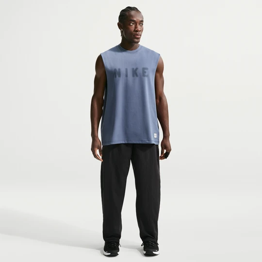 Zdjęcie produktu Męskie spodnie treningowe z tkaniny Dri-FIT Nike N.A.C. - Czerń