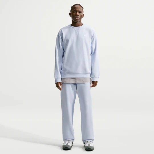 Zdjęcie produktu Męskie spodnie z dzianiny z luźnymi nogawkami Nike Solo Swoosh - Szary