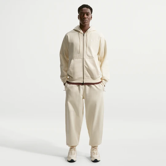 Zdjęcie produktu Męskie spodnie z dzianiny ze ściągaczami Nike Solo Swoosh - Biel