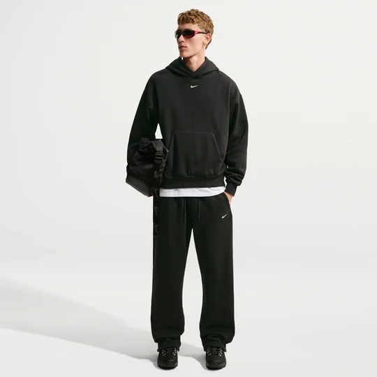 Zdjęcie produktu Męskie spodnie z elastycznym sznurkiem Nike Solo Fleece - Czerń
