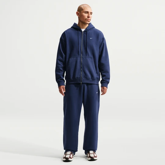 Zdjęcie produktu Męskie spodnie z elastycznym sznurkiem Nike Solo Fleece - Niebieski