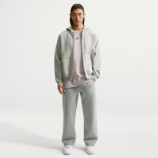 Zdjęcie produktu Męskie spodnie z elastycznym sznurkiem Nike Solo Fleece - Szary