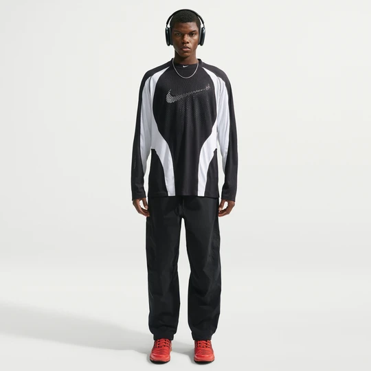 Zdjęcie produktu Męskie spodnie z luźnymi nogawkami Dri-FIT Nike Tech Helios - Czerń