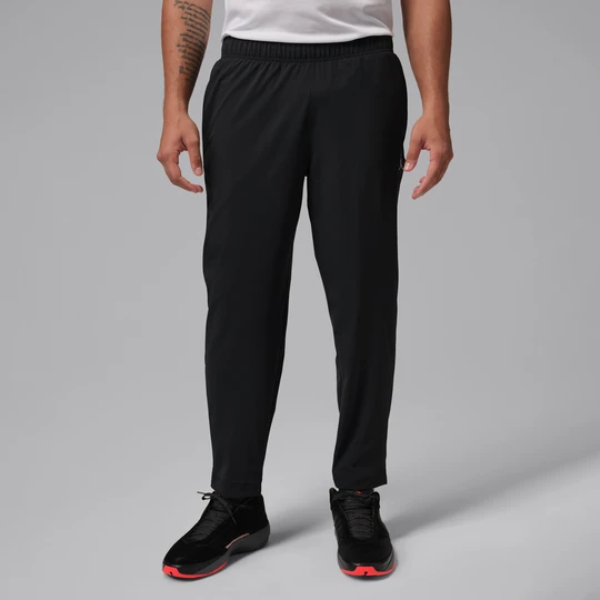 Zdjęcie produktu Męskie spodnie z tkaniny Dri-FIT Jordan Sport Essentials - Czerń
