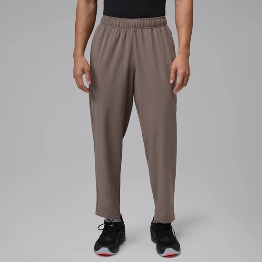 Zdjęcie produktu Męskie spodnie z tkaniny Dri-FIT Jordan Sport Essentials - Szary