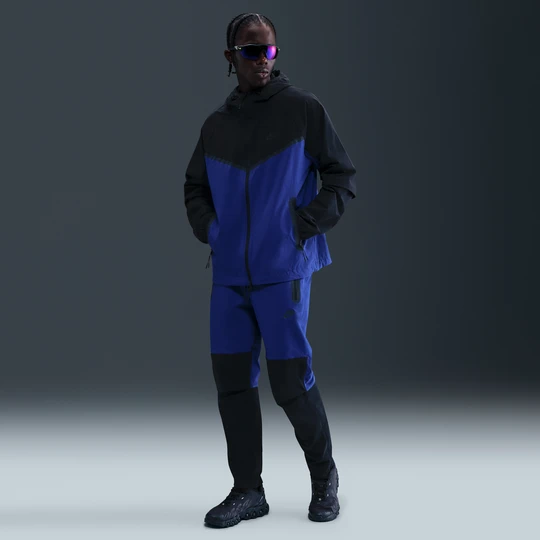 Zdjęcie produktu Męskie spodnie z tkaniny Nike Tech - Niebieski