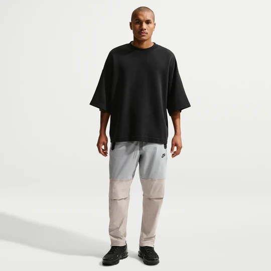 Zdjęcie produktu Męskie spodnie z tkaniny Nike Tech - Szary
