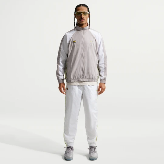 Zdjęcie produktu Męskie spodnie z tkaniny Nike Tuned Air - Biel