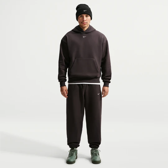 Zdjęcie produktu Męskie spodnie ze ściągaczem Nike Solo Fleece - Brązowy