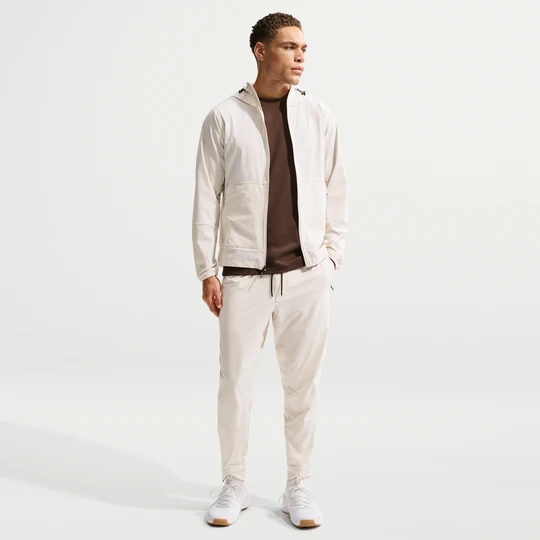 Zdjęcie produktu Męskie uniwersalne spodnie ze ściągaczami i zamkami Dri-FIT Nike Unlimited - Brązowy