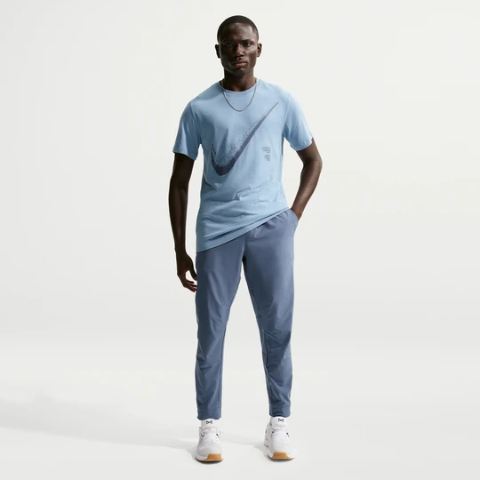 Zdjęcie produktu Męskie uniwersalne spodnie ze ściągaczami i zamkami Dri-FIT Nike Unlimited - Niebieski