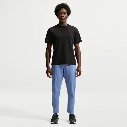 Zdjęcie produktu Męskie uniwersalne spodnie ze ściągaczami i zamkami Dri-FIT Nike Unlimited - Niebieski