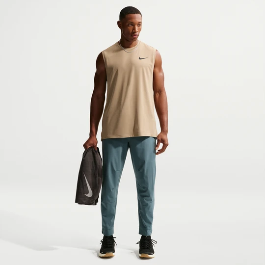 Zdjęcie produktu Męskie uniwersalne spodnie ze ściągaczami i zamkami Dri-FIT Nike Unlimited - Szary