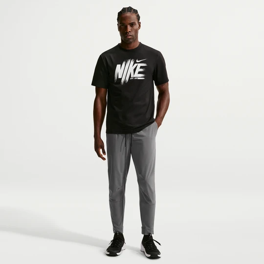 Zdjęcie produktu Męskie uniwersalne spodnie ze ściągaczami i zamkami Dri-FIT Nike Unlimited - Szary