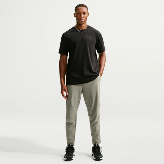 Zdjęcie produktu Męskie uniwersalne spodnie ze ściągaczami i zamkami Dri-FIT Nike Unlimited - Zieleń